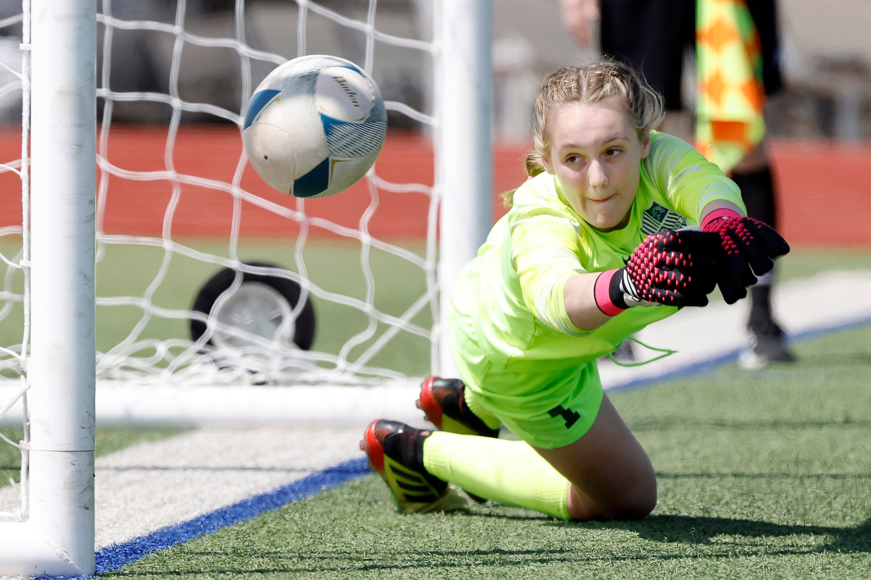 Frisco Reedy goalkeeper  Kennedy Wilkinson dives as a Frisco shootout kick gets past her in...