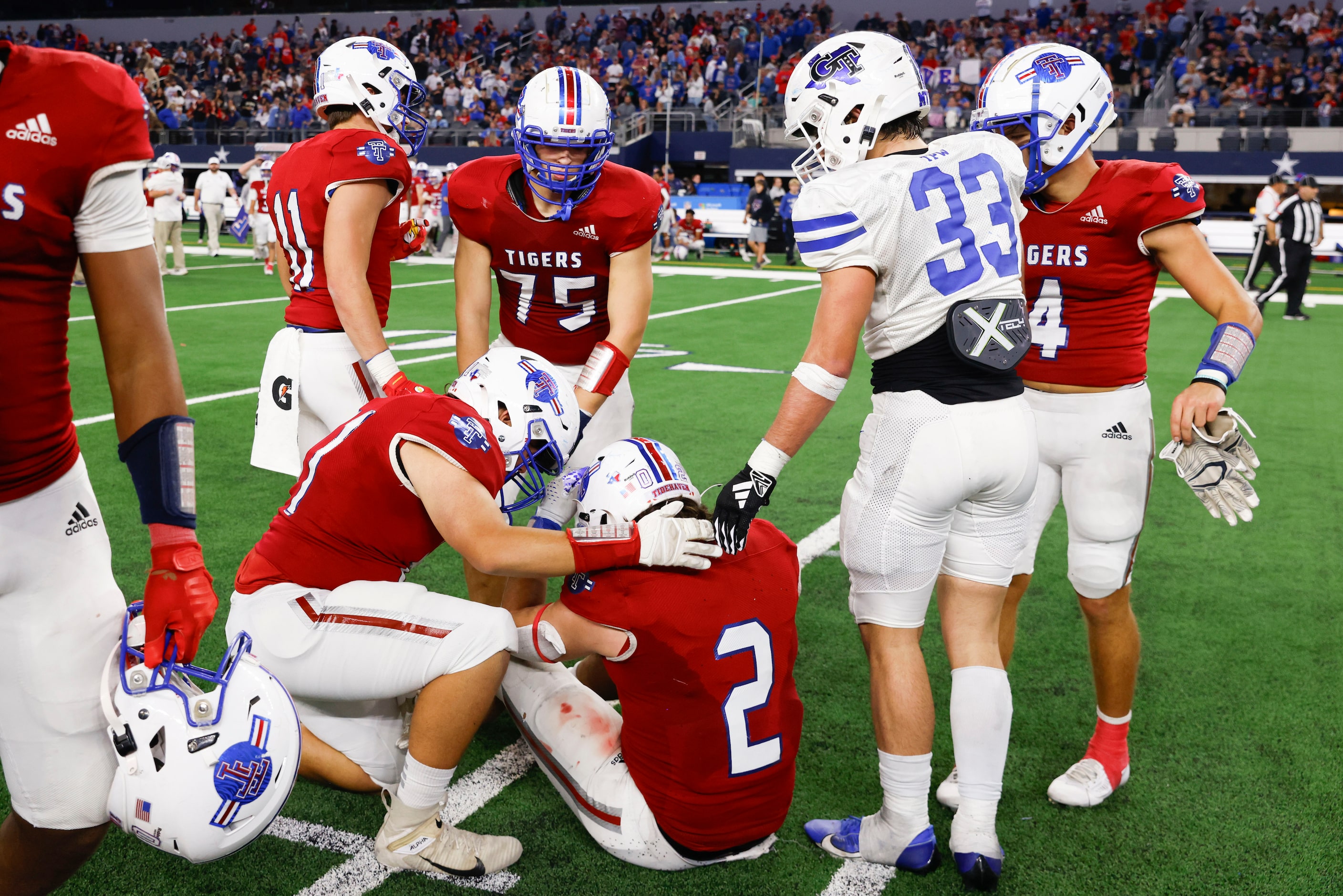 El Maton Tidehaven’s Jachen Duran (2) receives condolences by his teammates after Gunter...