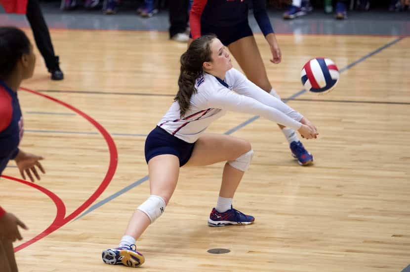 Allen senior libero Shelby Perlich digs a hit by Southlake Carroll during their playoff...