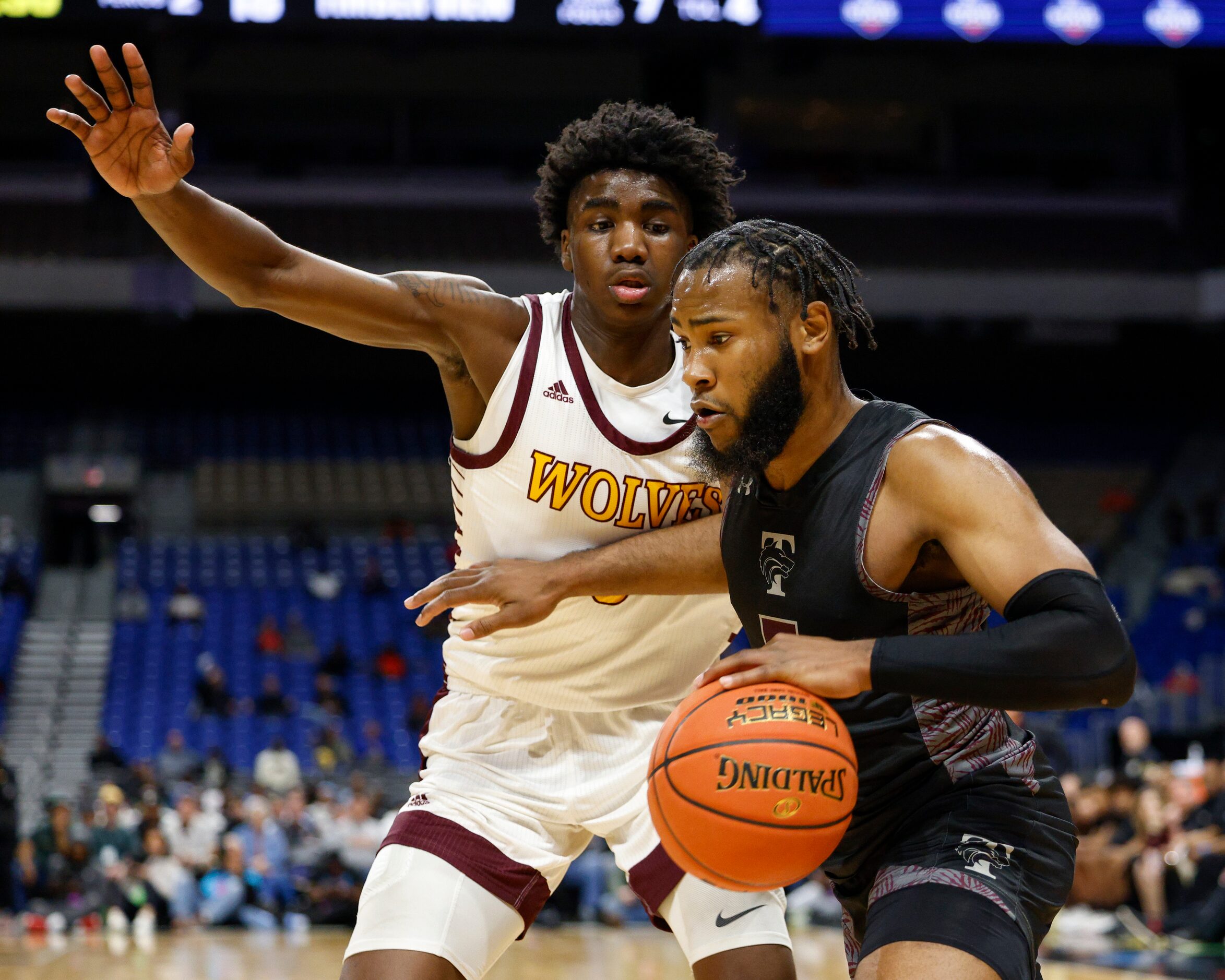 Mansfield Timberview guard Jared Washington (5) drives the ball towards Beaumont United...