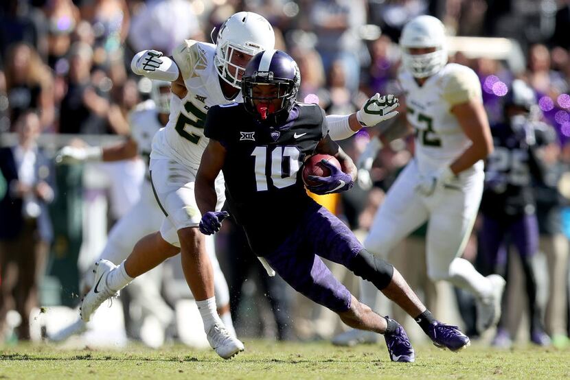 FORT WORTH, TX - NOVEMBER 24:  Desmon White #10 of the TCU Horned Frogs carries the ball...