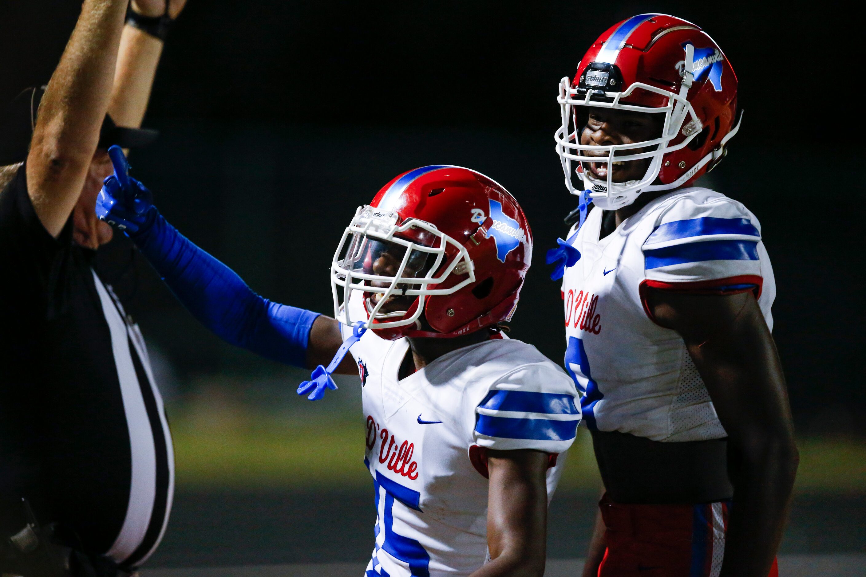 Duncanville junior defensive back Lamoderick Spencer, center, celebrates scoring a touchdown...