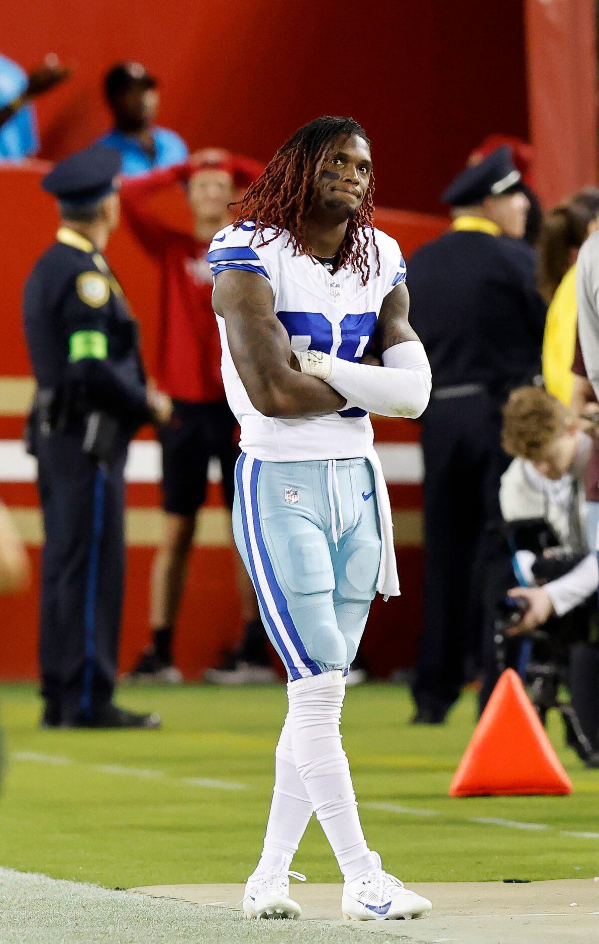 Dallas Cowboys wide receiver CeeDee Lamb (88) watches from the far end of the sideline after...