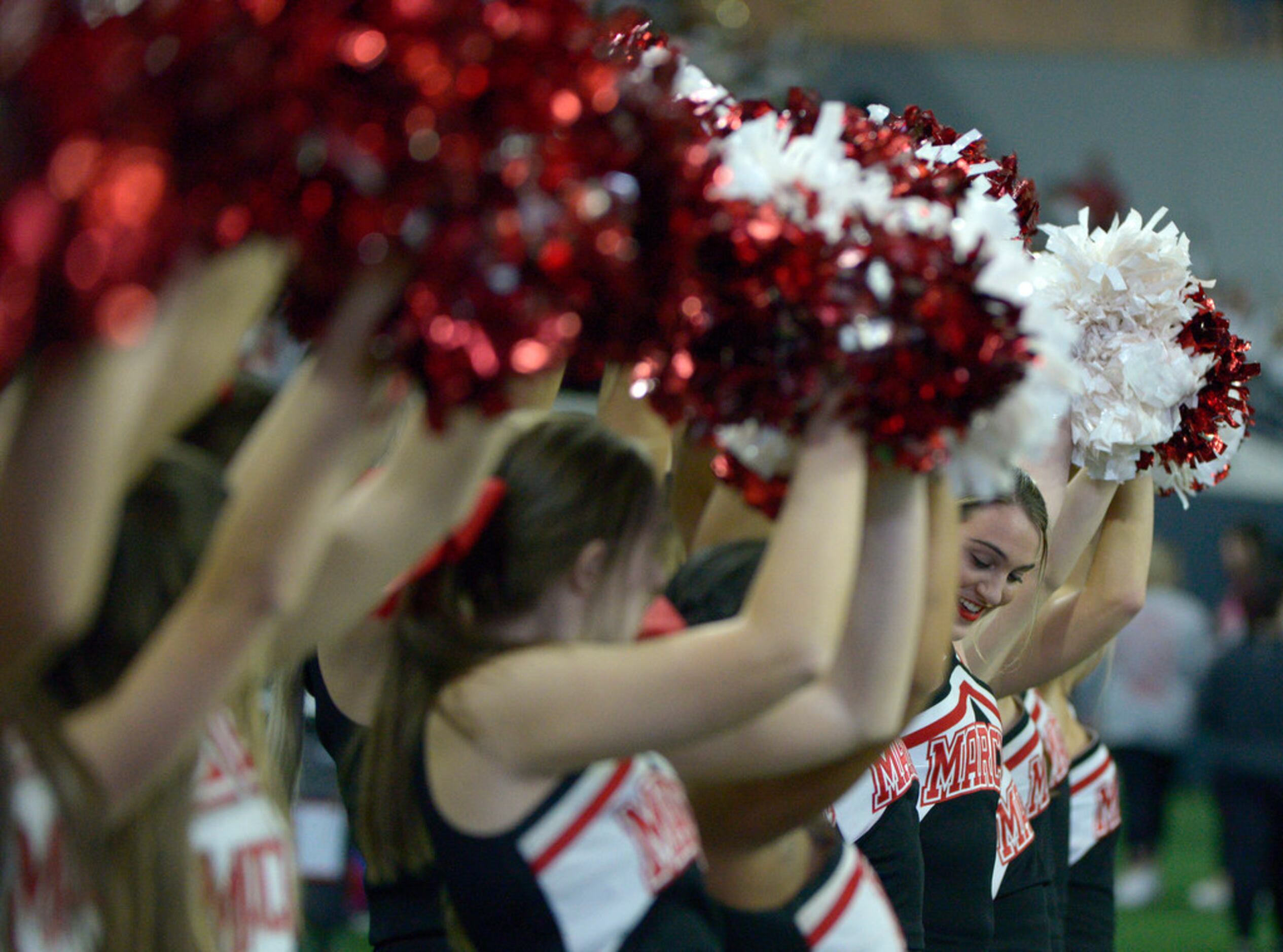 Flower Mound Marcus cheerleaders in the first half of a Class 6A Division II area round high...