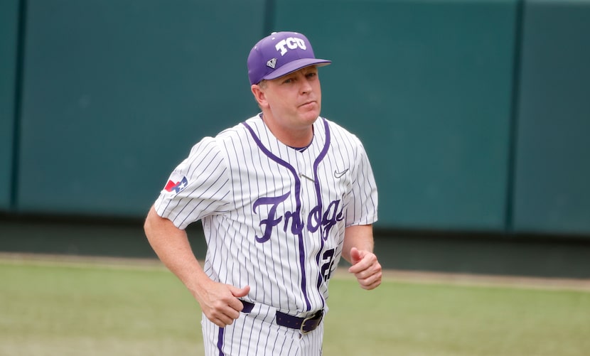 TCU baseball coach Jim Schlossnagle walks off the field prior to playing Oregon St. during...