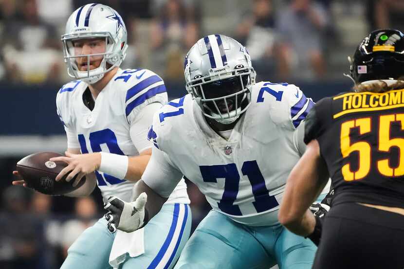 Dallas Cowboys offensive tackle Jason Peters (71) provides protection for quarterback Cooper...