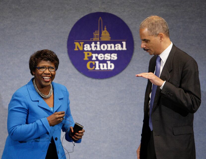 Then-Attorney General Eric Holder shared a moment with Gwen Ifill during an NAACP Legal...