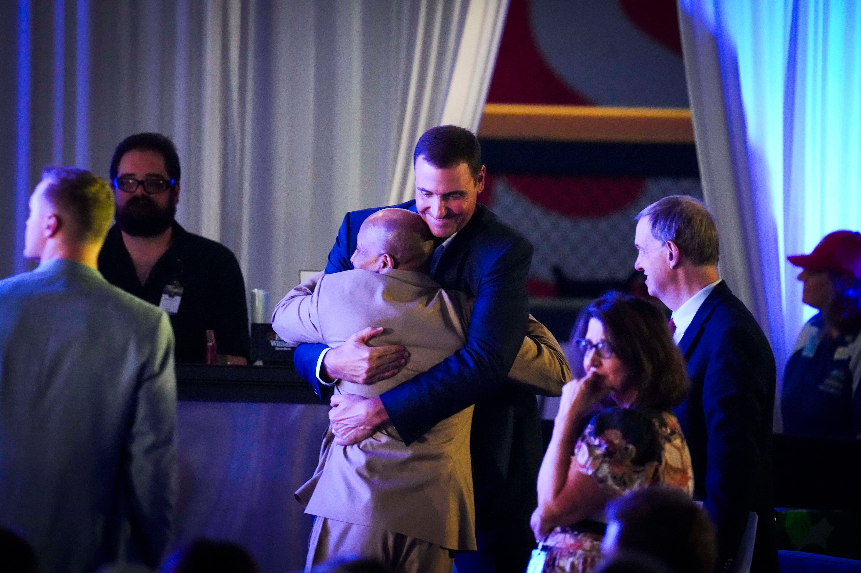 Texas Rangers general manager Chris Young hugs third base coach Tony Beasley at the...