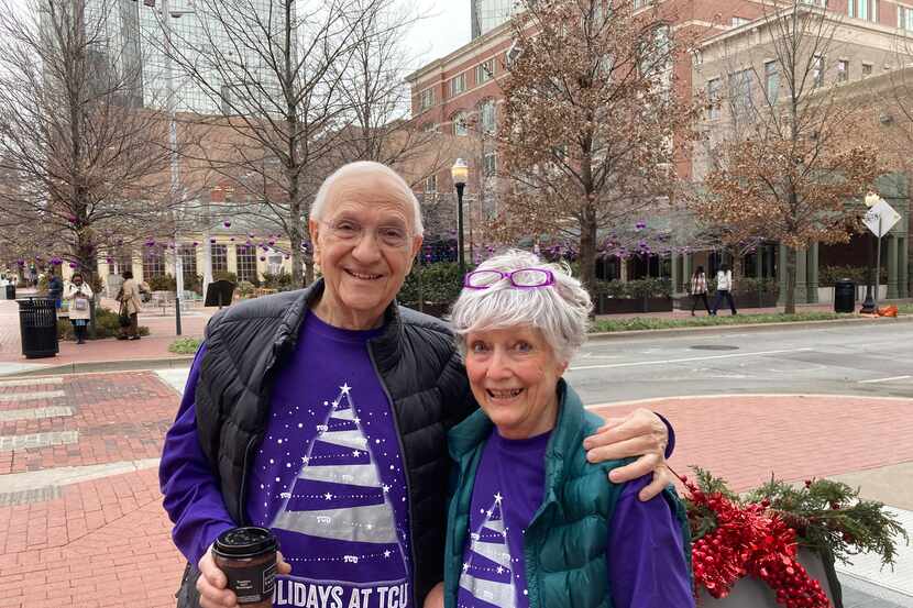 From left, Louis and Sally Coates participate in Go Purple Friday at Sundance Square.