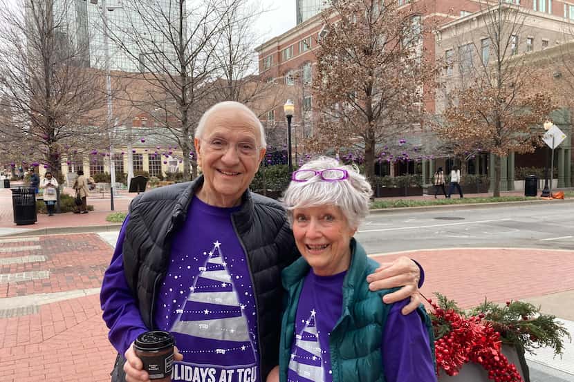 From left, Louis and Sally Coates participate in Go Purple Friday at Sundance Square.