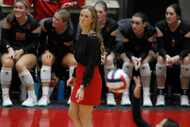 Lovejoy coach Natalie Puckett watches as one of her players serves during a Class 5A state...