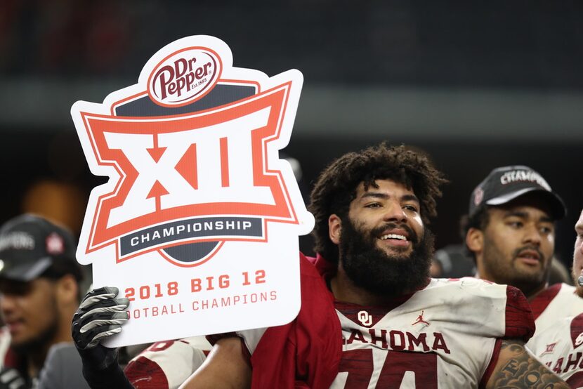 ARLINGTON, TEXAS - DECEMBER 01:  Cody Ford #74 of the Oklahoma Sooners celebrates a 39-27...