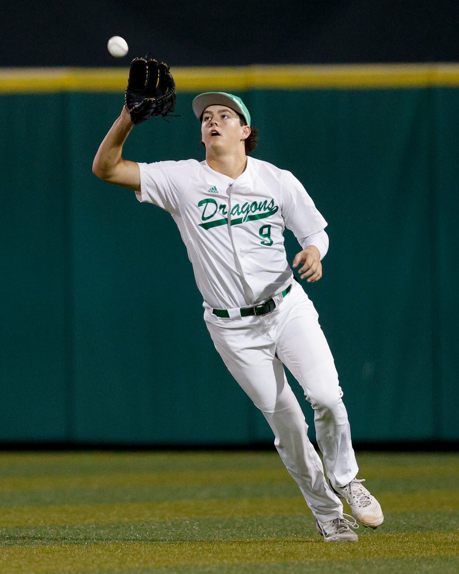 Southlake Carroll centerfielder Owen Proksch (9) makes a catch for an out during the first...