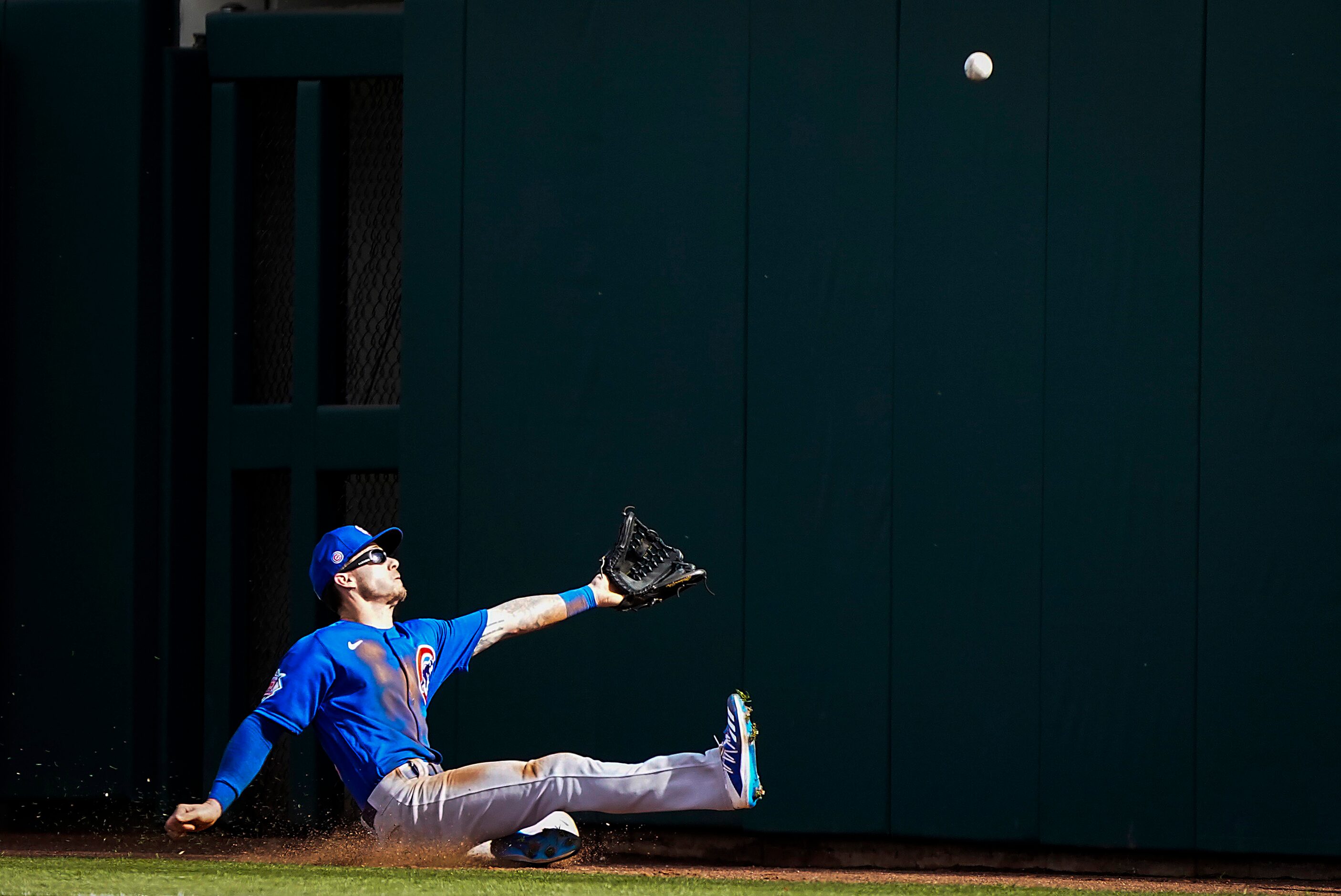 Chicago Cubs outfielder Ian Miller canÕt make a sliding catch on a foul ball off the bat of...