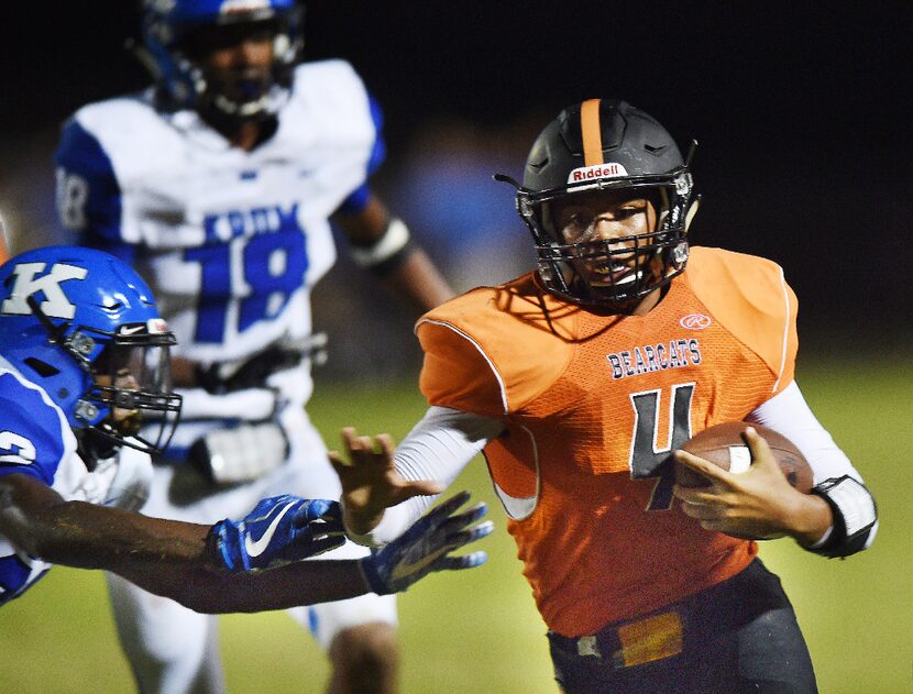 Krum linebacker Deontrell Butts (22) tries to tackle Pilot Point quarterback Jacob Pitts (4)...