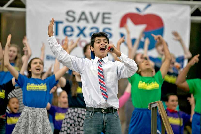 
Alvaro Aguillar  (center) performed with Fort Worth’s Kids Who Care musical theater group...