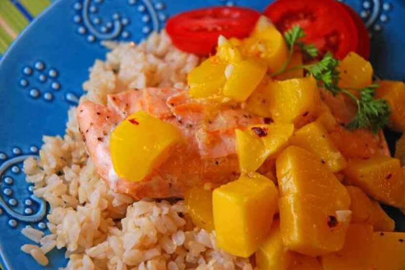
Fresh mango adds a sweet flavor boost to salmon fillets.
