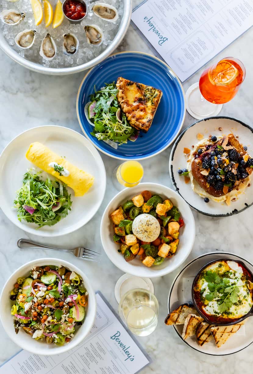 Overhead photo showing plates of food on a table.