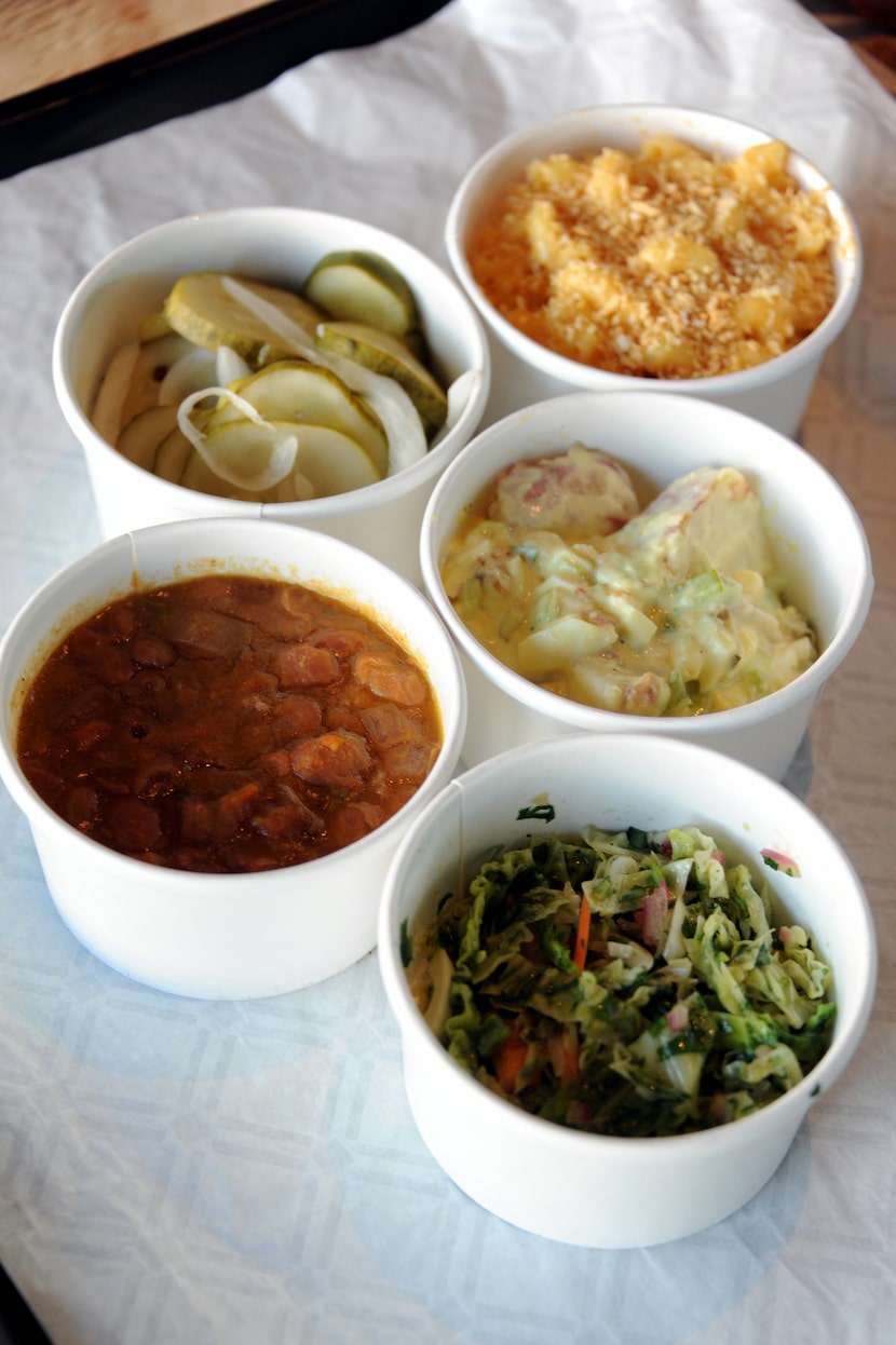 Guests can choose sides such as coleslaw, beans, potato salad, mac n' cheese and house-made...