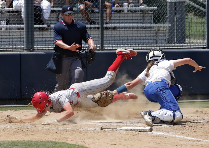 Flower Mound Marcus High School player #3, Haidyn Sokoloski, slides into home during a...