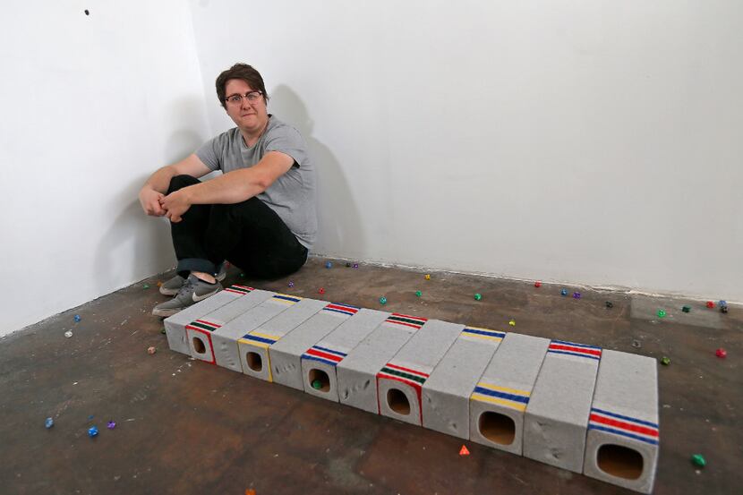 Artist Shelby David Meier poses with his sculpture called "Nothing feels better (gray)" at...