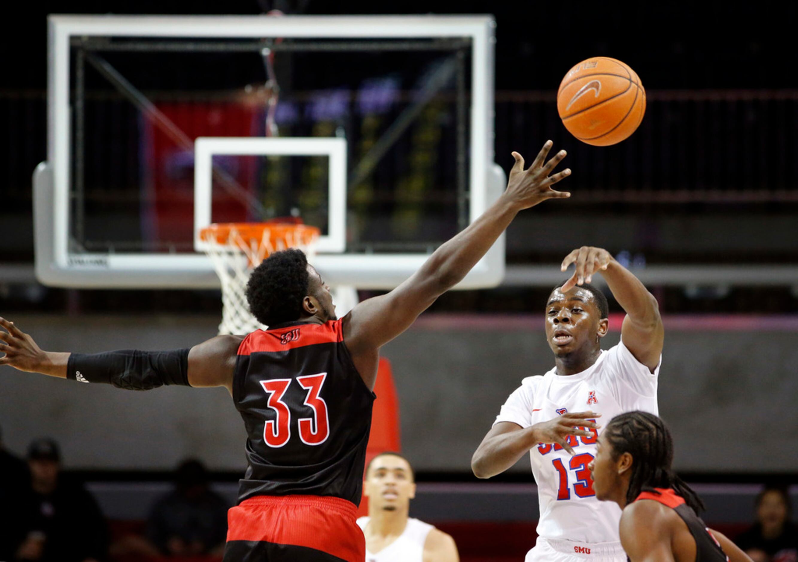 Southern Methodist Mustangs guard CJ White (13) passes the ball over Jacksonville State...