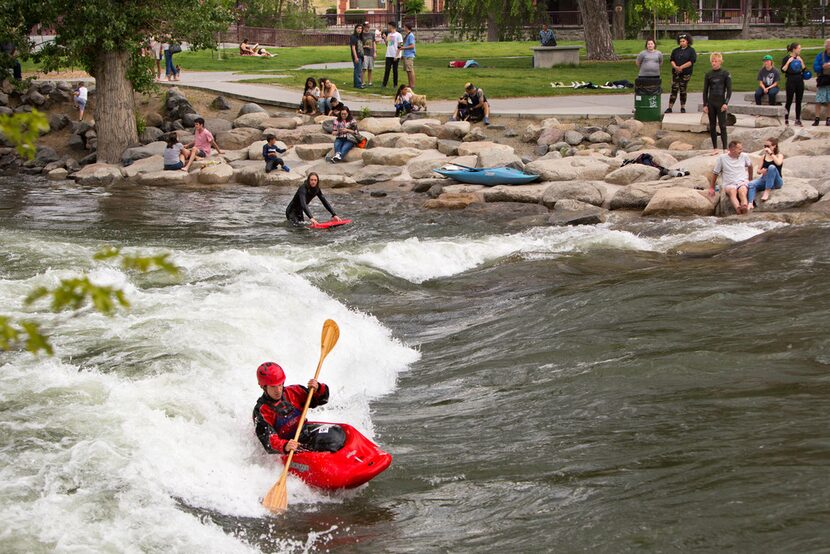 Former junior world champion freestyle kayaker and Reno native Jason Craig surfs the Truckee...