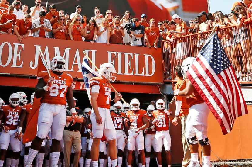 The Texas Longhorns prepare to take the field before the University of Maryland Terrapins...
