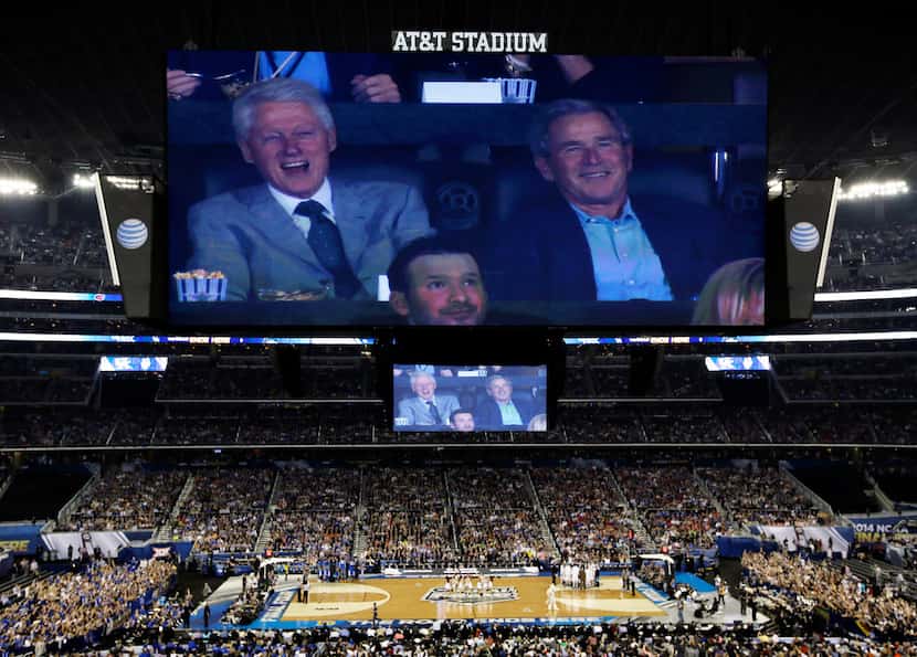Former presidents Bill Clinton and George W. Bush watched action between Connecticut and...