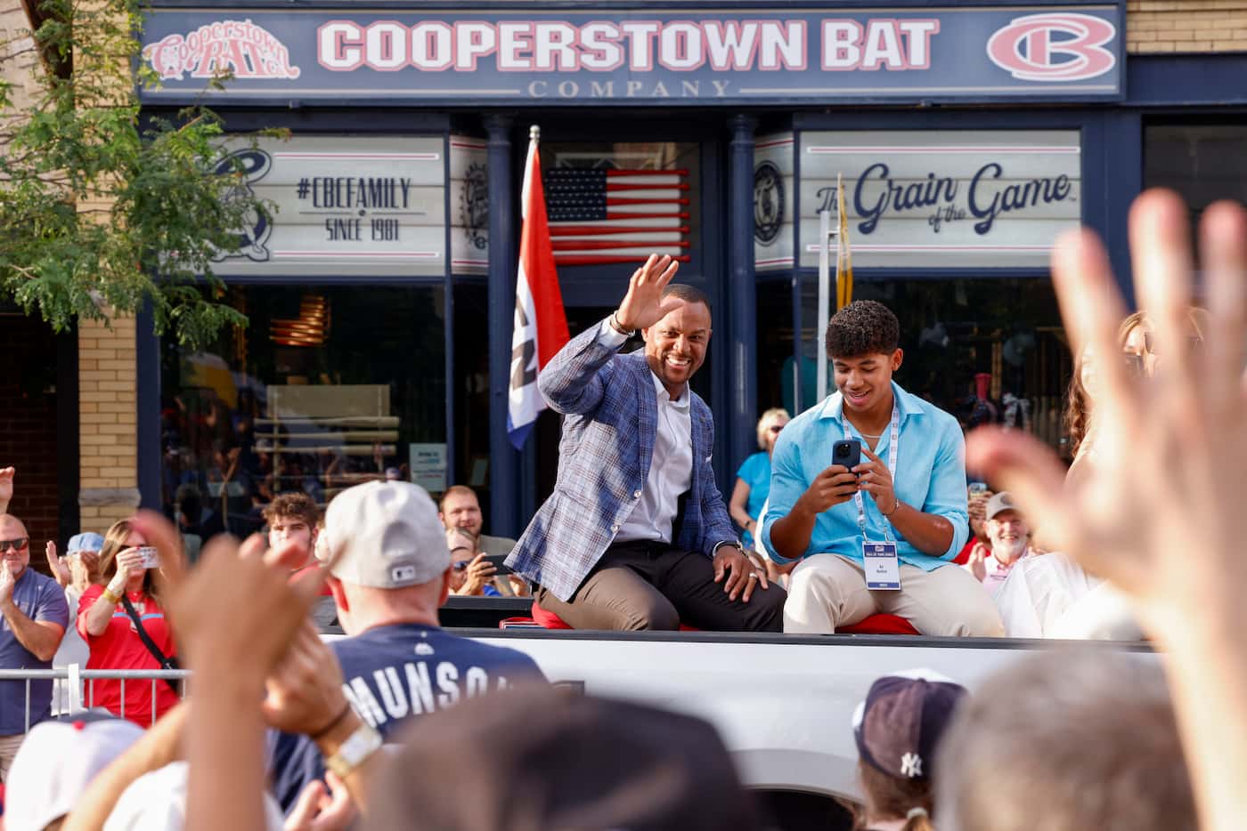Former Texas Rangers third baseman Adrián Beltré waves to fans alongside his son Adrián...