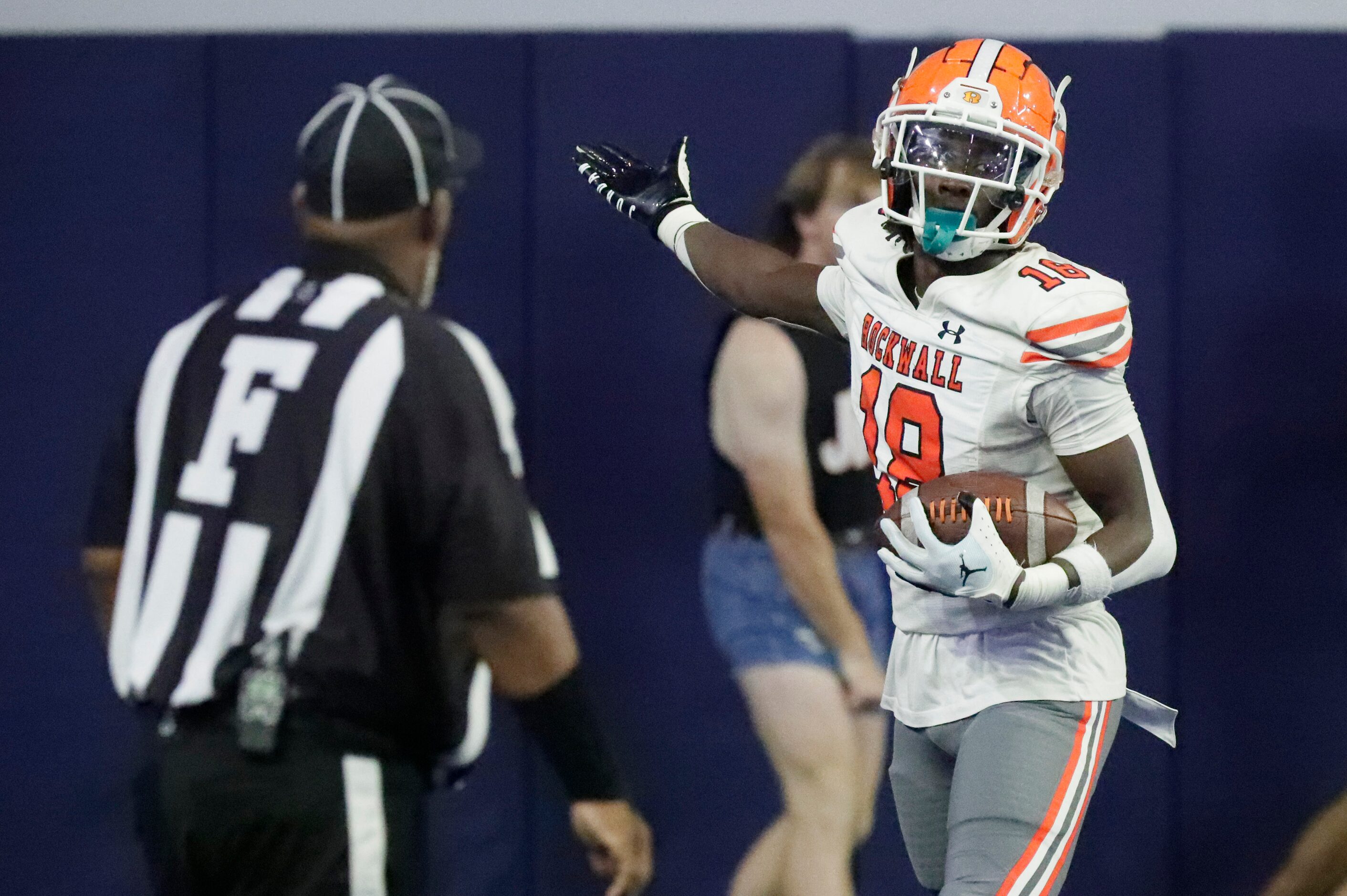 Rockwall High School wide receiver Matthew Young (18) celebrates after a touchdown, the team...