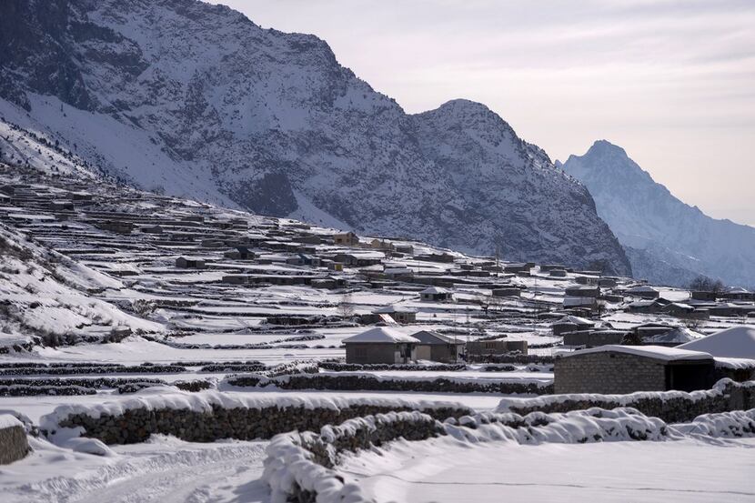 This photo, taken Jan. 29, shows a view of snow-covered homes in the Naltar Valley, some 15...