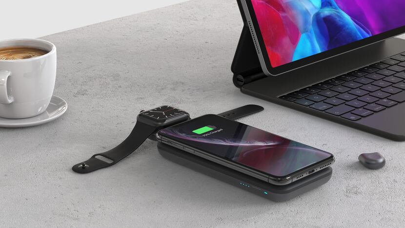 The Anker PowerWave Go 3-in-1 Charging Stand with the battery detached and charging a phone...