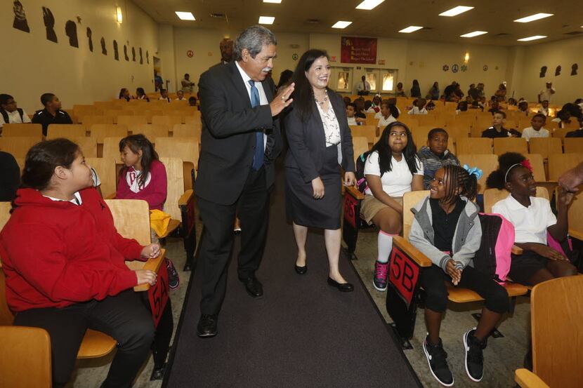  Interim DISD Superintendent Michael Hinojosa, center left, and Principal Marisa Saenz,...