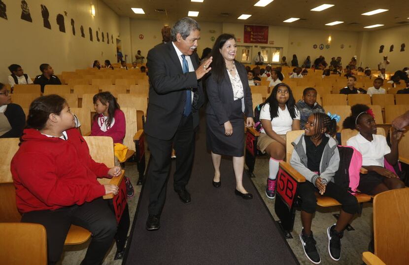  Interim DISD Superintendent Michael Hinojosa, center left, and Principal Marisa Saenz,...