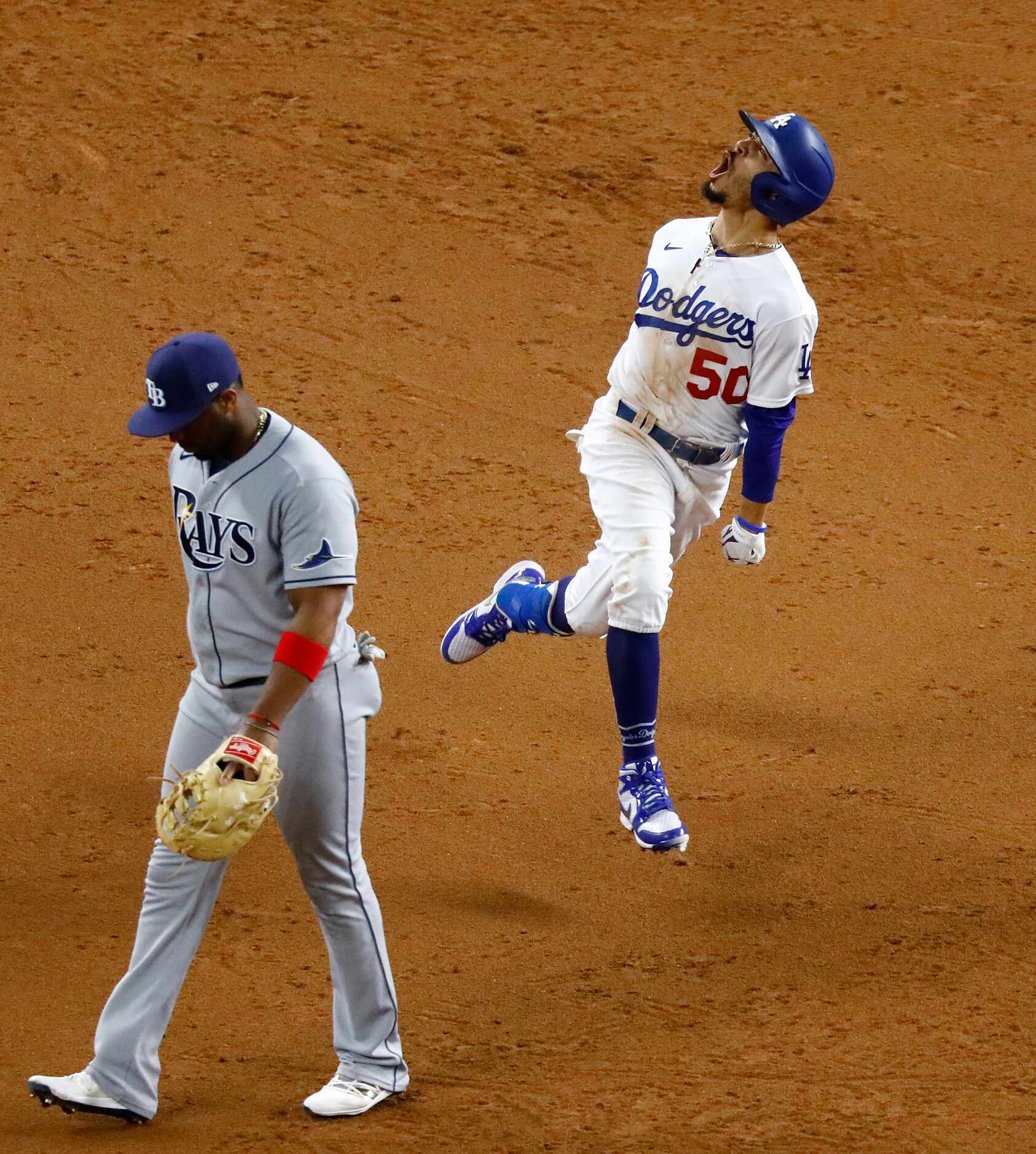 Los Angeles Dodgers Mookie Betts (50) reacts in front off Tampa Bay Rays first baseman Yandy...