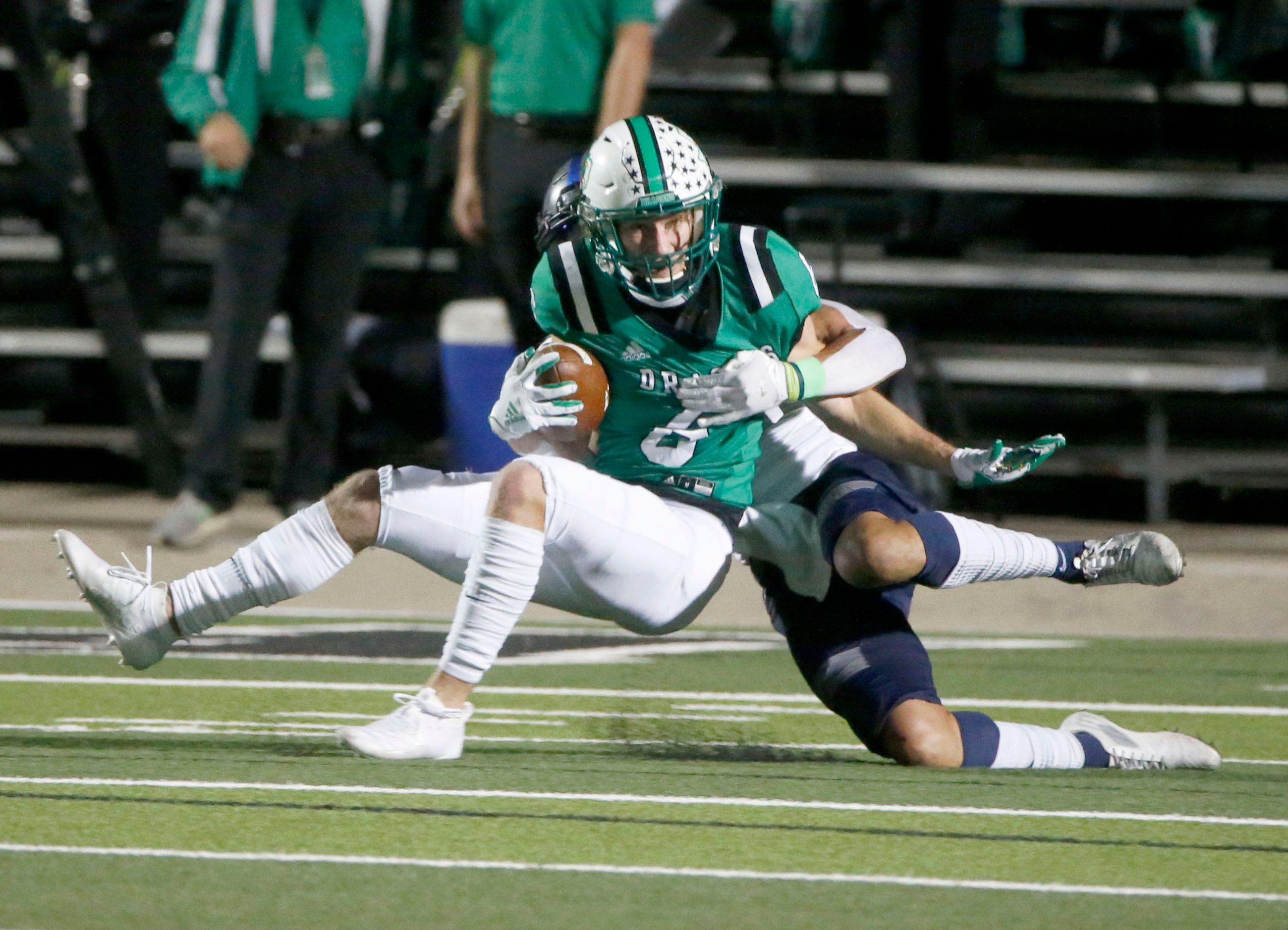 Southlake receiver Landon Samson (6) is tackled short of the goal line by Eaton cornerback...