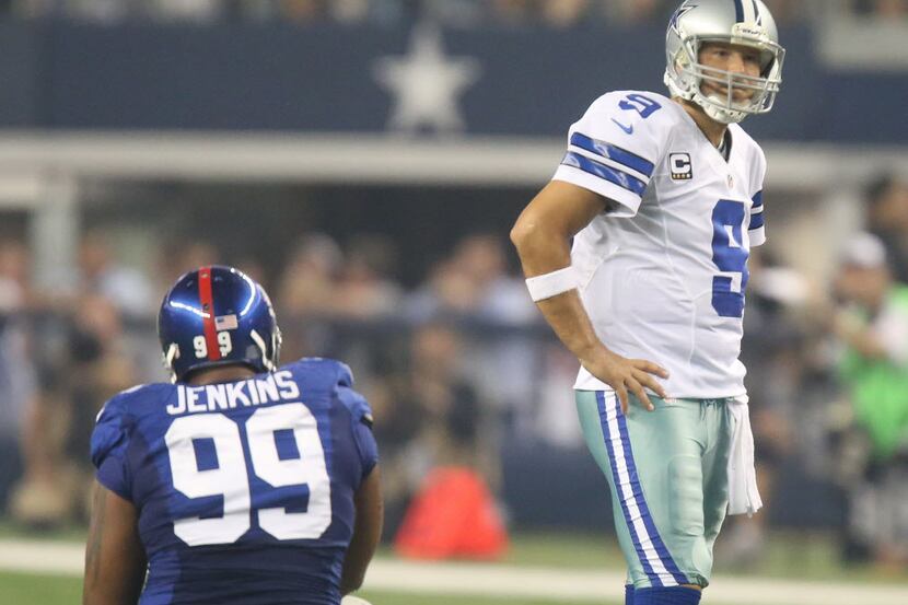 Dallas Cowboys quarterback Tony Romo (9) looks at an official as New York Giants defensive...