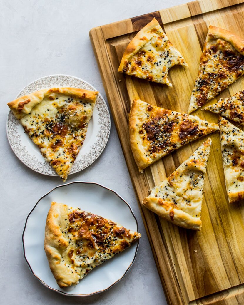 This white pizza is topped with Everything But the Bagel Sesame Seasoning Blend from Trader...