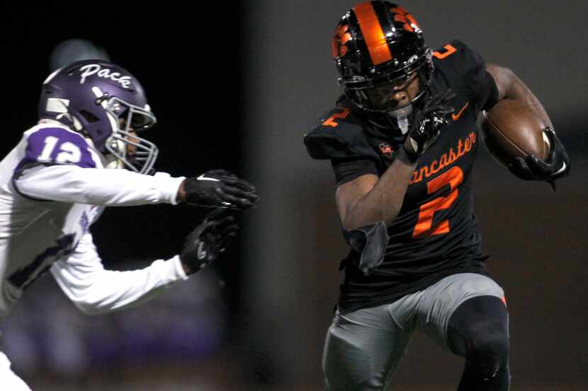 Lancaster running back Kewan Lacy (2) pulls away from the defensive pursuit of Lufkin...