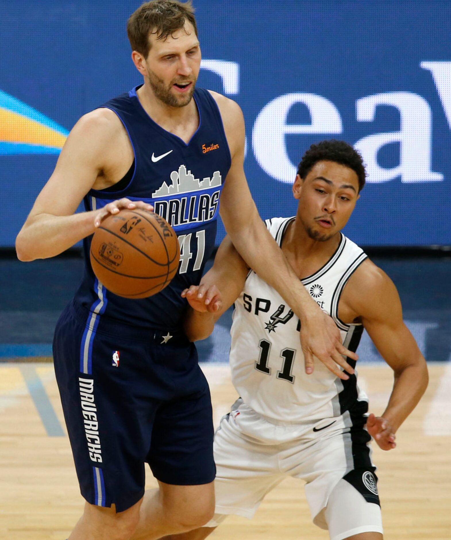 Dallas Mavericks forward Dirk Nowitzki (41) looks for room around San Antonio Spurs guard...