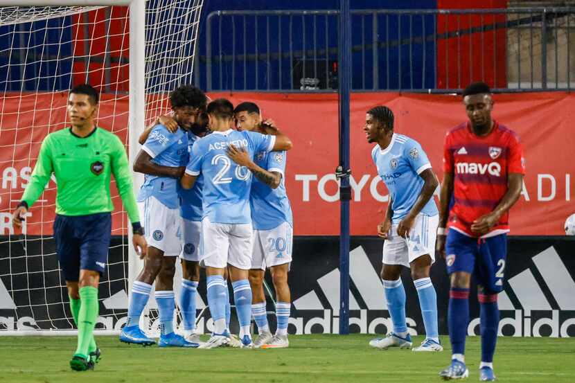 New York City team celebrates their first goal over FC Dallas during the first half at the...