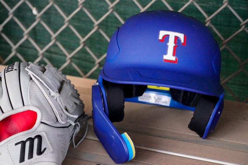 Infielder Davis Wendzel’s helmet and glove are seen in a practice field dugout during a...