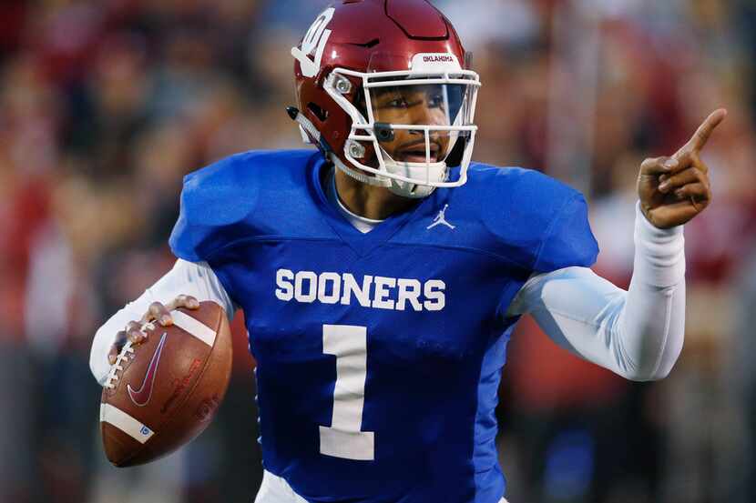 FILE - In this Friday, April 12, 2019 file photo, Oklahoma quarterback Jalen Hurts gestures...