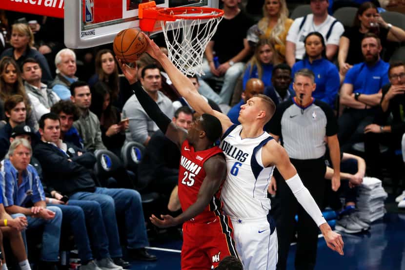 Dallas Mavericks forward Kristaps Porzingis (6) blocks a shot by Miami Heat guard Kendrick...