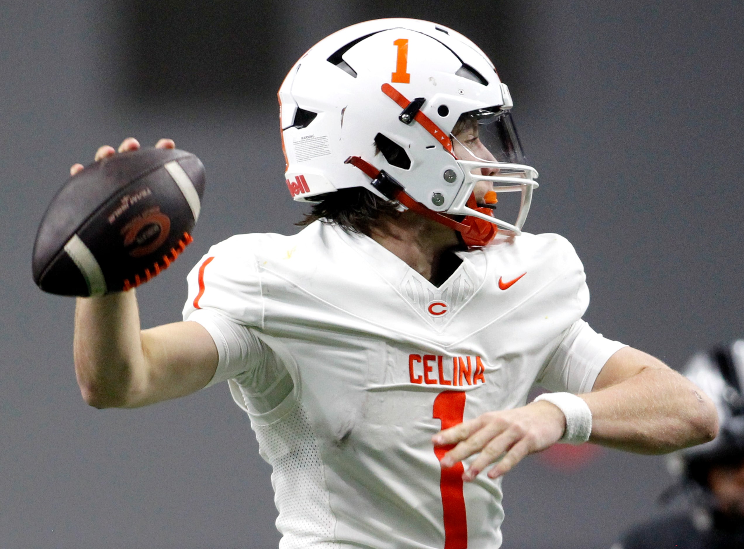 Celina quarterback Bowe Bentley (1) gets off a pass during first quarter action against...