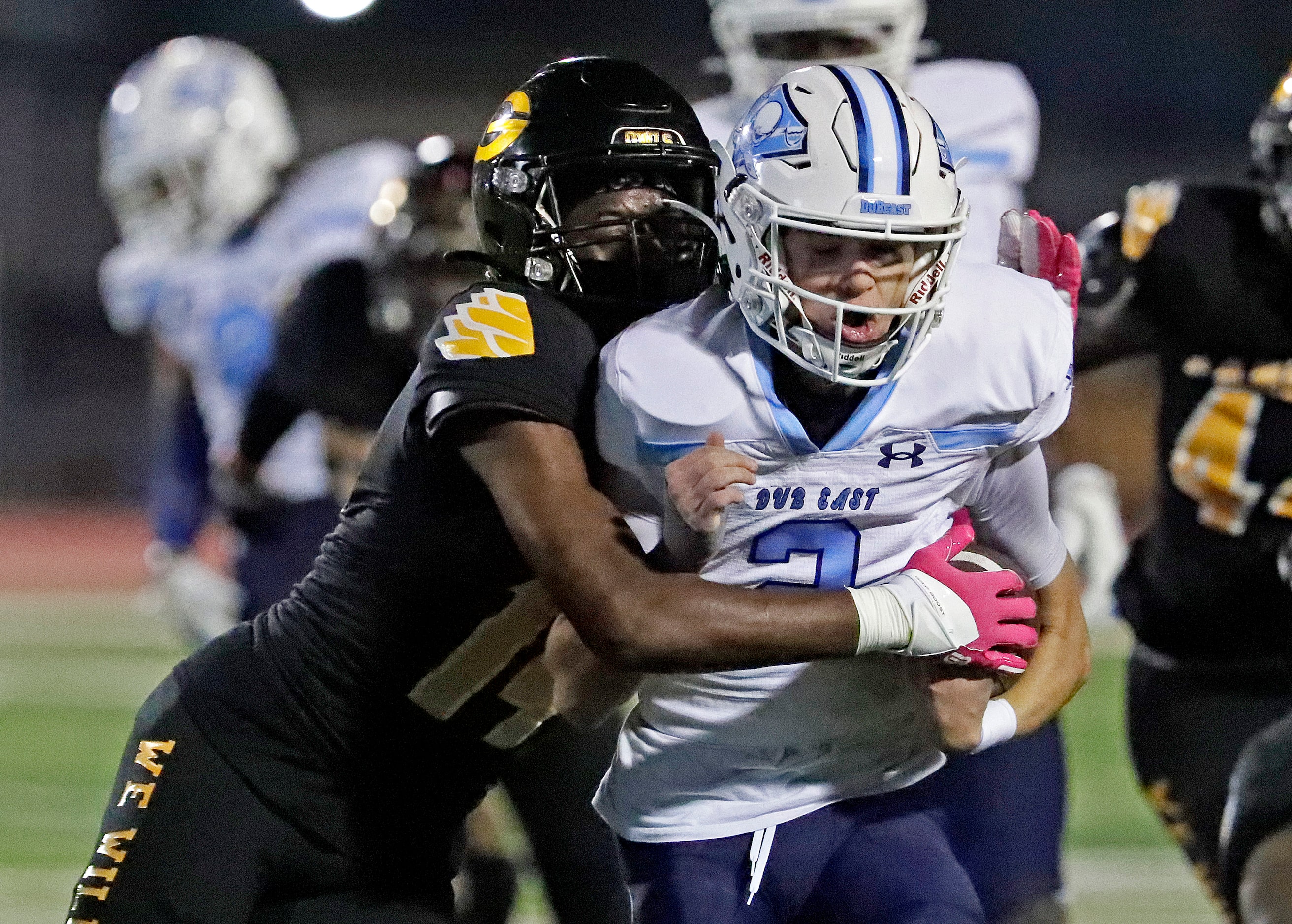 Wylie East High School quarterback Jon Jon Connelly (2) is tackled by Garland High School...