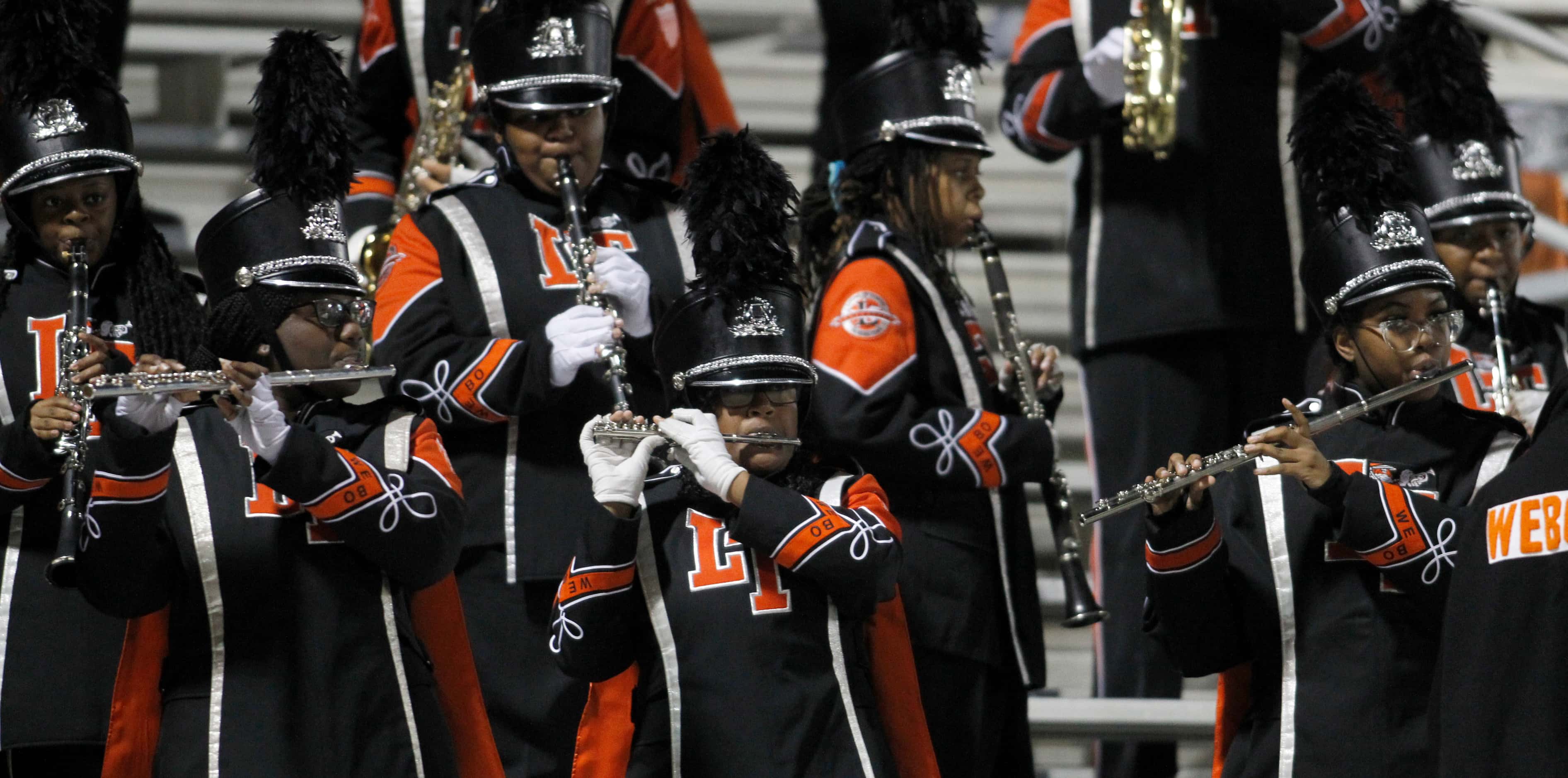 Members of the Lancaster band perform from the stands during the first half of the Lancaster...