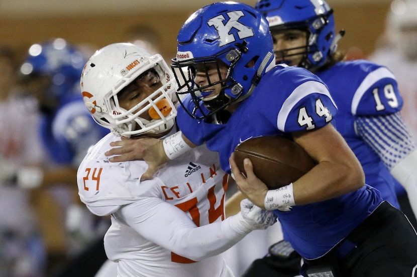 Celina's Jose Torres attempts to tackle Krum's Haeden Knight in the 1st half as Celina faces...