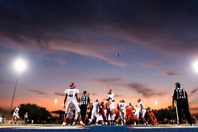 Duncanville kicks an extra point after a touchdown run by running back Kelion Elder (22)...